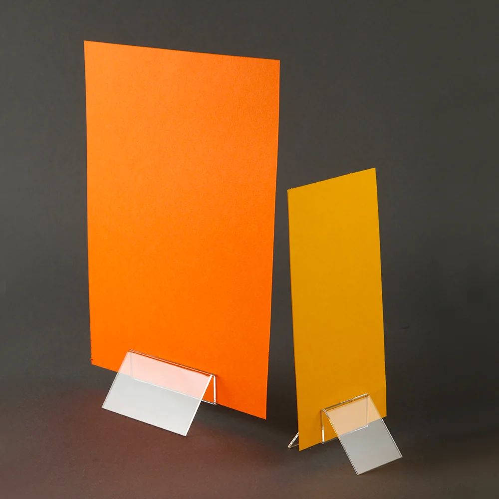 acrylic menu holder base clip stands holding plain card to represent a menu.